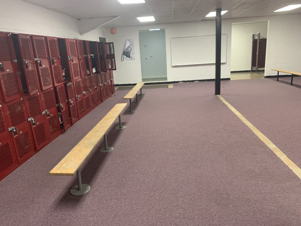 Boy's locker room under basketball stands